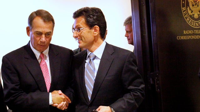 House Speaker John Boehner of Ohio, left, shakes hands with House Majority Leader Eric Cantor of Virginia as they leave a news conference on Capitol Hill in Washington Aug. 1, 2011. 