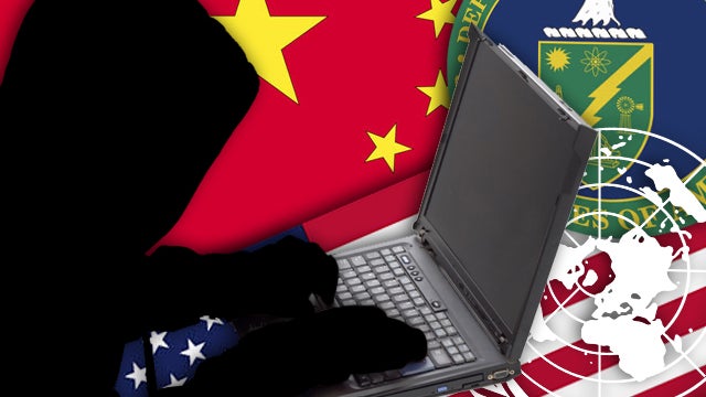 Hacker in the front of a laptop computer 