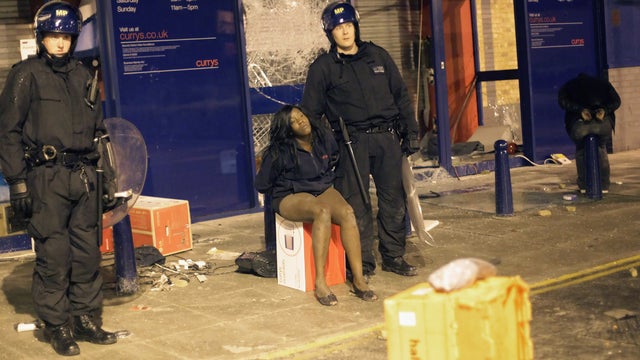 Two girls are detained outside a south London electrical store 