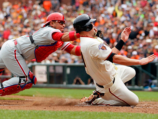 Aubrey Huff is tagged out at home plate 