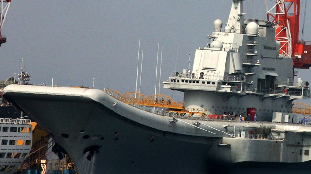 China's first aircraft carrier, the former Soviet carrier Varyag, is seen Aug. 4, 2011, at the Port of Dalian in northeast China's Liaoning Province. The aircraft carrier has begun its inaugural sea trial, the defense ministry said Aug. 10, 2011, a move l 