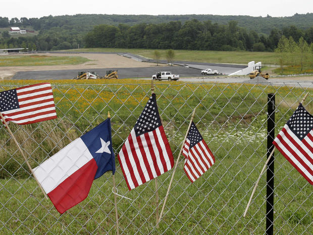 Flags hang on a fence overlooking the crash site of Flight 93 in Shanksville, Pa. 