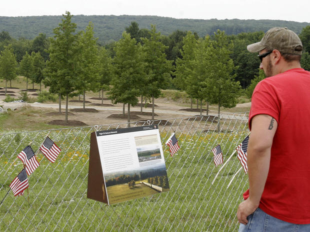 Lloyd Smith, left, and Laura Sprankle of Hagerstown, Md., visit the overlook at the temporary Flight 93 memorial in Shanksville, Pa. on Aug. 1, 2011. 
