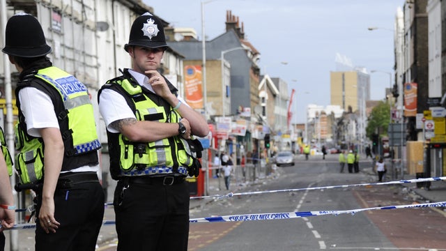 Police on the streets of Croydon, a suburb south of London 