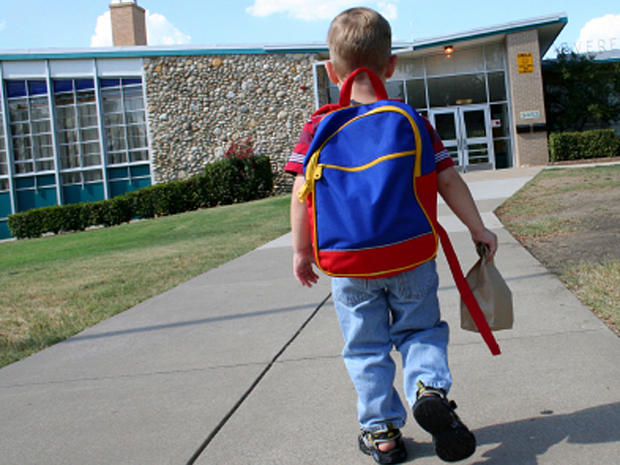 Schoolboy walking up to school 