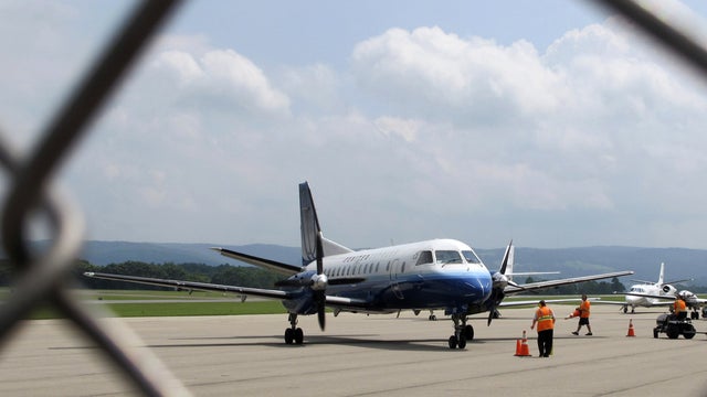 Ground crew working a flight at Morgantown Municipal Airport 