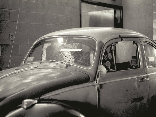 John Busby's bullet-riddled car is shown impounded at the Falmouth, Mass. police station.  