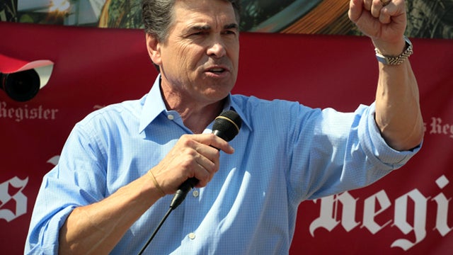 DES MOINES, IA - AUGUST 15: Republican presidential candidate and Texas Governor Rick Perry speaks to visitors at the Iowa State Fair August 15, 2011 in Des Moines, Iowa. The visit is part of Perry's first campaign trip to Iowa since declaring he would se 