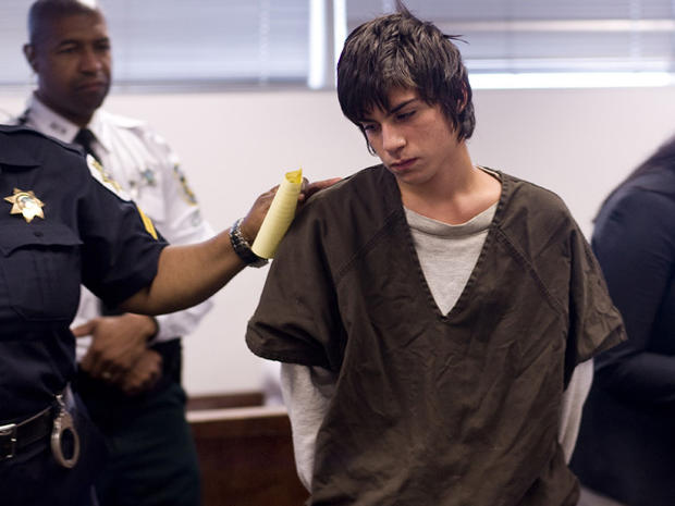 Jared Cano, 17, center, is led out of a courtroom in Tampa, Fla., Aug. 17, 2011, after being charged with possession of bomb-making materials in connection with a plot for an attack at Freedom High School on the first day of school. He was arrested Aug. 1 