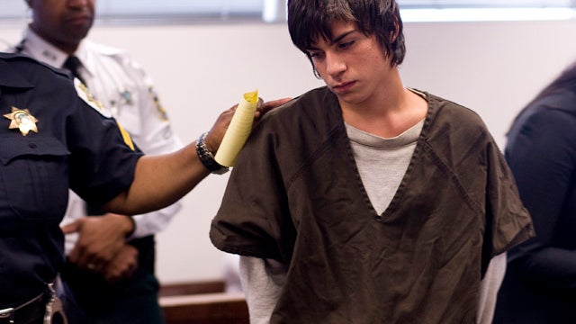 Jared Cano, 17, center, is led out of a courtroom in Tampa, Fla., Aug. 17, 2011, after being charged with possession of bomb-making materials in connection with a plot for an attack at Freedom High School on the first day of school. He was arrested Aug. 1 