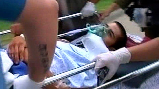 An injured man is carried on a bed by hospital staff at Soroka hospital in Beersheba, Israel, Aug. 18, 2011, in this image provided by Associated Press Television News. Assailants armed with heavy weapons, guns and explosives launched three attacks in qui 