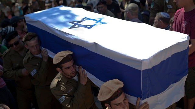 Golani Brigade soldiers carry the coffin of Staff Sgt. Moshe Naftali, 22 and a Golani combatant killed during a series of coordinated gun and roadside bomb attacks on the Israeli-Egyptian border Aug. 18, 2011, at Mount Herzl Military Cemetery Aug. 19, 201 