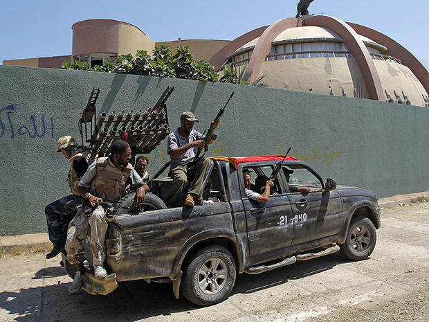 Rebel fighters seen inside the main Moammar Gadhafi compound in Bab al-Aziziya in Tripoli, Libya, Aug. 24, 2011.  