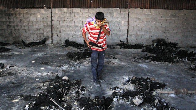 Qaddafi troops slaughter detainees 