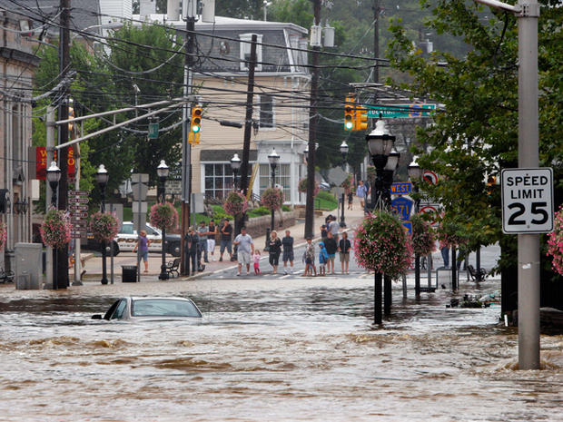 A car sits submerged on Main Street in Hightstown, N.J.  