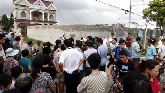 Chinese parents wait for their children 