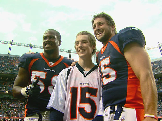 von-miller-and-tim-tebow-with-a-fan.jpg 