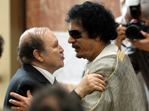 Libyan leader Muammar Qaddafi, right, embraces Algerian President Abdelaziz Bouteflika during the opening session of the Arab League Extraordinary Summit in the Libyan coastal city of Sirte. 