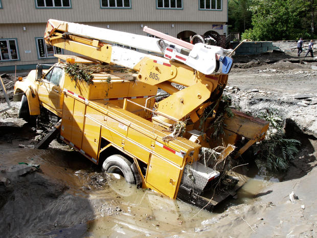 A truck lies in a hole created by the raging waters created by Tropical Storm Irene on  Aug. 29, 2011 in Berlin, Vt.   