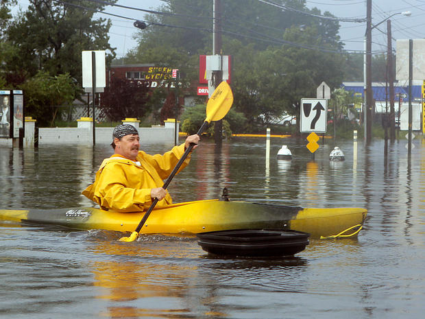 Kevin Holligan kayaks across a flooded section of Hyland Boulevard in Staten Island, N.Y., after the rain and wind of Tropical Storm Irene subsided, Aug. 28, 2011 on Staten Island, N.Y.   