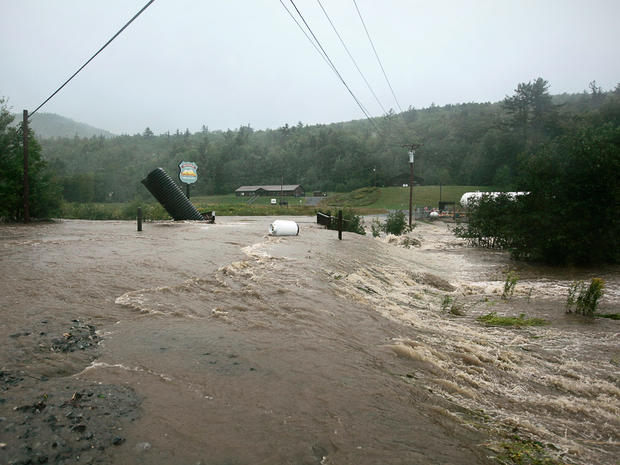 A propane tank floats in the floodwater that overwhelmed a road off Whaleback Mountain Road in Lebanon, N.H., Aug. 28, 2011. 