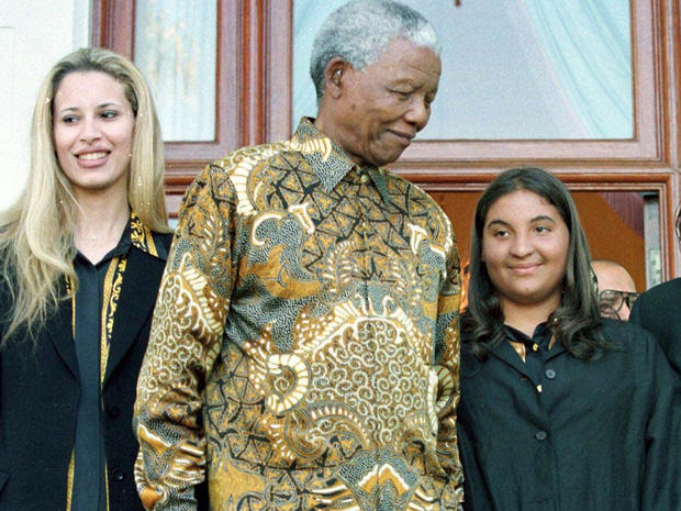 Nelson Mandela with Muammar Qaddafi's daughters 