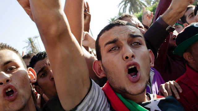 People celebrate at Martyrs' Square, formerly known as Green Square, for the Eid Al-Fitr prayer Aug. 31, 2011, in Tripoli, Libya. Libyans celebrated the first Eid Al-Fitr in 42 years under a new regime. 