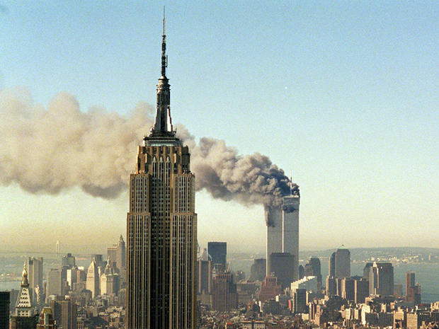 The twin towers of the World Trade Center burn  