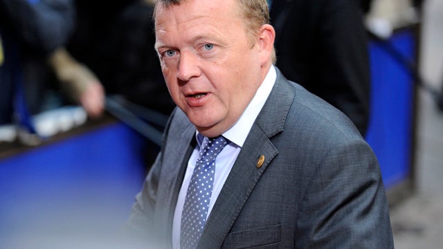 Danish Prime Minister Lars Loekke Rasmussen, seen in this June 24, 2011, file photo, told public broadcaster DR that seven Danish hostages, including a family with teenage children, were on their way back to Denmark in a chartered airplane after more than 