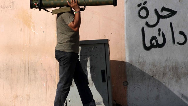 A Libyan rebel holds a portable rocket launcher near the main square of Zawiya, Libya, Aug. 18, 2011. 
