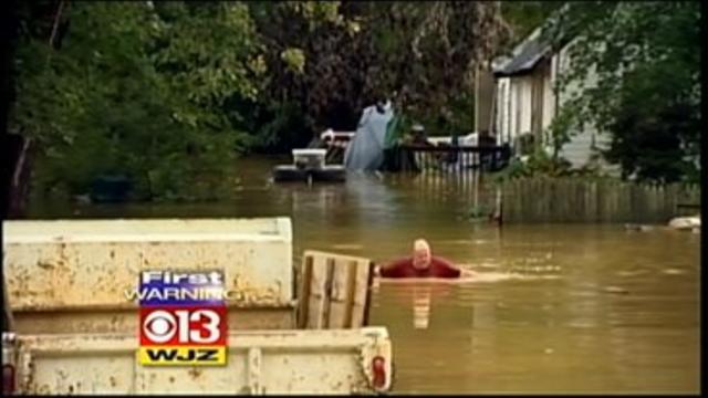 flooding-man-wading-through-water-aa-county.jpg 