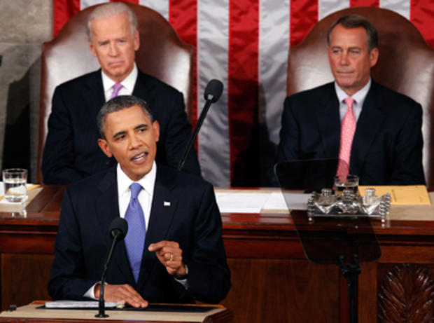 President Barack Obama delivers a speech to a joint session of Congress at the Capitol in Washington, Thursday, Sept. 8, 2011. Watching are Vice President Joe Biden and House Speaker John Boehner. 