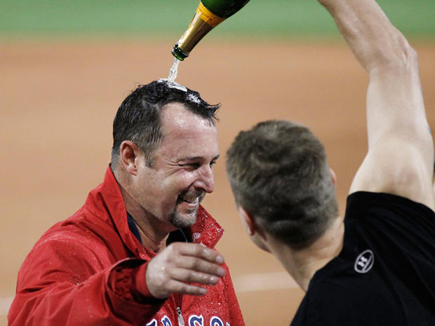 Tim Wakefield has champagne poured on him 