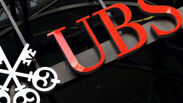 The sign for the U.K. headquarters of the Swiss banking group UBS is seen Sept. 15, 2011, in London after it was announced that unauthorized trades by an investment banker had cost the bank $2 billion. Police have arrested a 31-year-old man in connection  