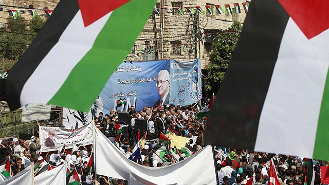 Palestinians participate in a rally in support of Palestinian bid for statehood recognition in the United Nations, in the West Bank city of Hebron, Sept. 21, 2011.  