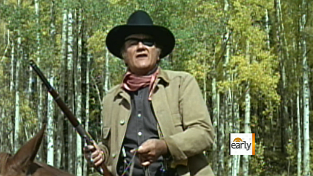 John Wayne in scene typical of his career 
