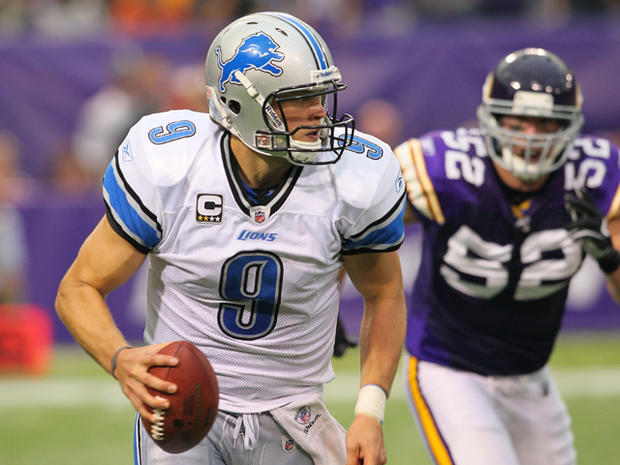 Matthew Stafford is chased by Chad Greenway 