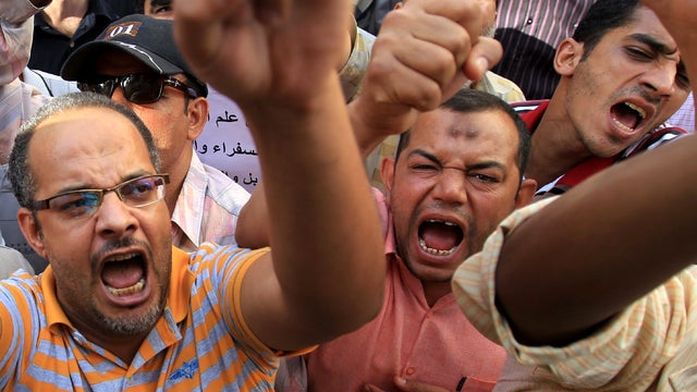 Thousands of Egyptian teachers protest during a strike in front of the prime minister's office in downtown Cairo Sept. 24, 2011, demanding better pay and vowing to continue a strike that has crippled several schools around the country. 