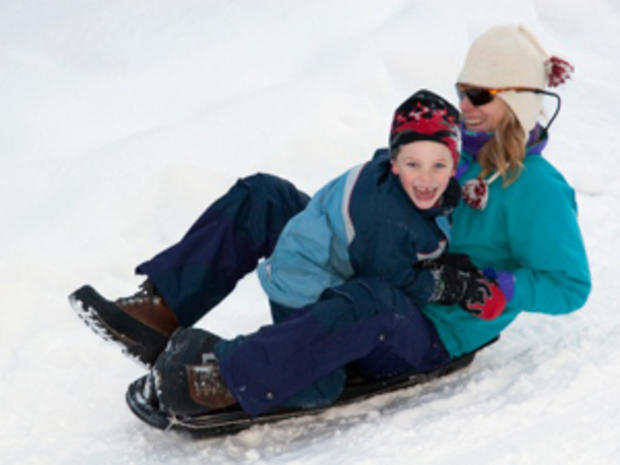 12/23/11 - A Guide To Twin Cities' Sledding Hills - mother and son on sled 
