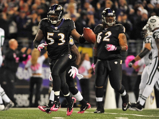 Jameel McClain celebrates his touchdown  
