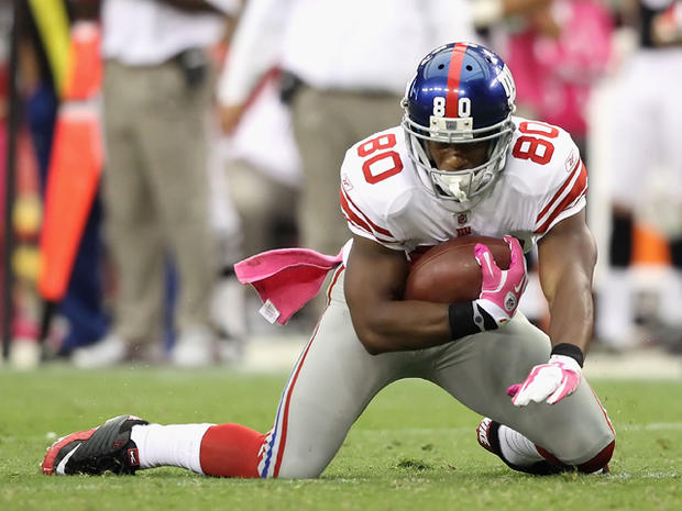 Victor Cruz falls to the ground untouched after a reception 