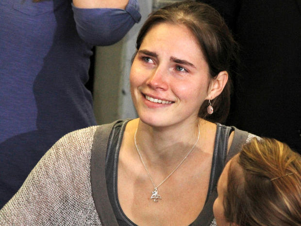 Amanda Knox is comforted by her sister, Deanna Knox, during a news conference shortly after her arrival at Seattle-Tacoma International Airport Oct. 4, 2011, in Seattle. Knox arrived home a day after she was acquitted of murder and sexual assault charges and freed from jail in Italy after a four-year ordeal. 