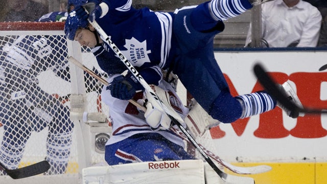 Colby Armstrong, top, collides with Carey Price  
