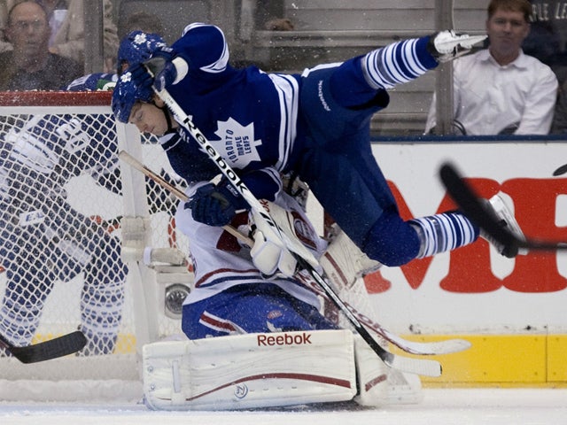 Colby Armstrong, top, collides with Carey Price  