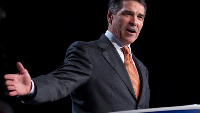Republican presidential hopeful Gov. Rick Perry of Texas gestures during a speech at the Values Voter Summit on Friday, Oct. 7, 2011, in Washington. 