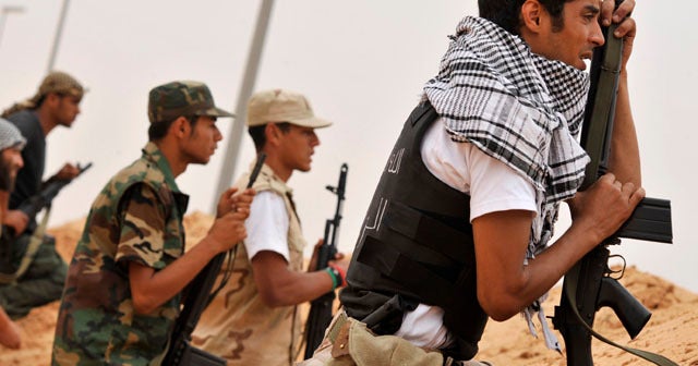 Libyan forces claim gains in Qaddafi's hometown - CBS News
