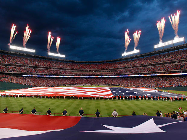 Fireworks fly after the Detroit Tigers and Texas Rangers are introduced 