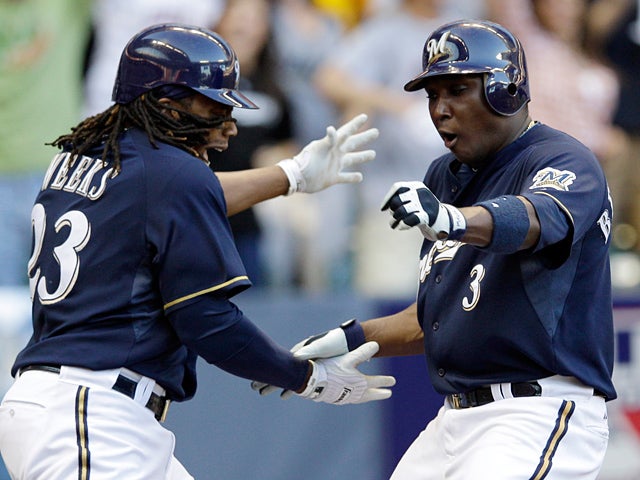 Yuniesky Betancourt is congratulated by Rickie Weeks 