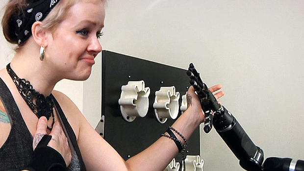 Robotic arm lets paralyzed man touch girlfriend 