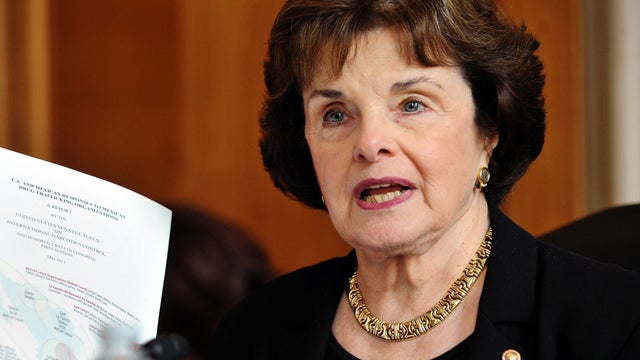 Sen. Dianne Feinstein, D-Calif., holds up a copy of a report at a Senate hearing May 25, 2011, in the Dirksen Senate Office building on Capitol Hill in Washington. 
